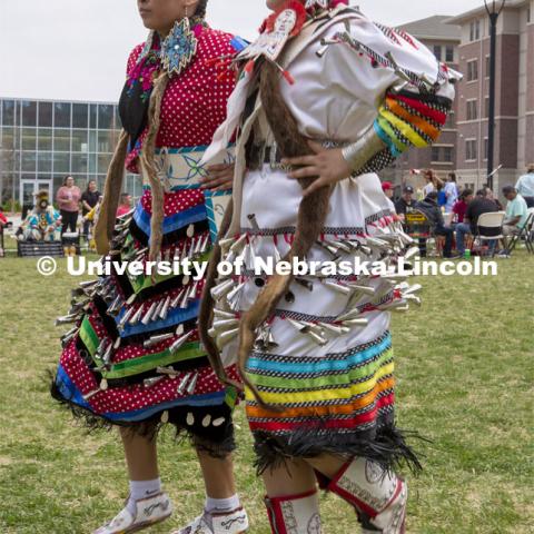 Jingle dress dancers Kaitlynn Miller and Tavia Miller perform a traditional dance during the 2022 UNITE powwow. 2022 UNITE powwow to honor graduates (K through college). Held April 23 on the greenspace along 17th Street, immediately west of the Willa Cather Dining Center. This was UNITE’s first powwow in three years. The MC was Craig Cleveland Jr. Arena director was Mike Wolfe Sr. Host Northern Drum was Standing Horse. Host Southern Drum was Omaha White Tail. Head Woman Dancer was Kaira Wolfe. Head Man Dancer was Scott Aldrich. Special contest was a Potato Dance. April 23, 2023. Photo by Troy Fedderson / University Communication.